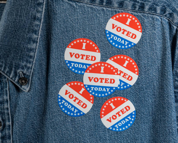 istock Blue denim working clothing with many Voted stickers 1054970398