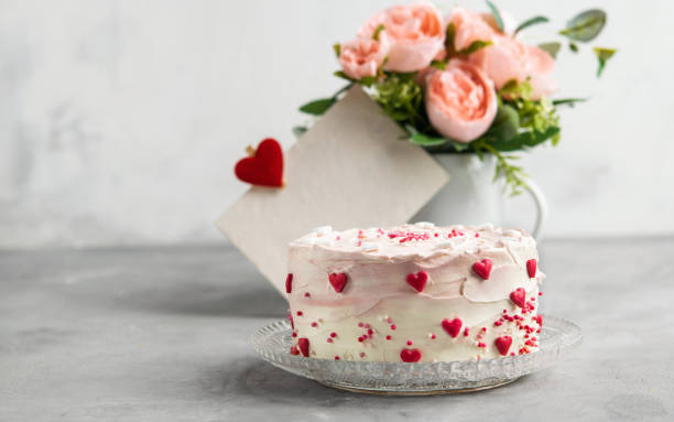 istock Cake with small hearts and colorful sprinkles on a plate with coffee. Grey stone background. Romantic love concept. Valentine's day, Mother's Day, Birthday Cake card. Valentines day background. 1054970856