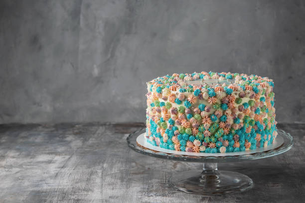 istock Buttercream frosted birthday cake on gray background. Copy space. Horizontal. Celebration concept. 1054970882