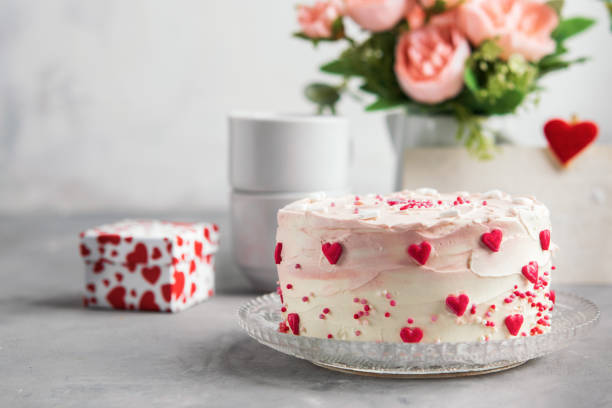 istock Cake with small hearts and colorful sprinkles on a plate with coffee. Grey stone background. Romantic love concept. Valentine's day, Mother's Day, Birthday Cake card. Valentines day background. 1054971104