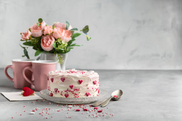 istock Cake with small hearts and colorful sprinkles on a plate with coffee. Grey stone background. Romantic love concept. Valentine's day, Mother's Day, Birthday Cake card. Valentines day background. 1054971136