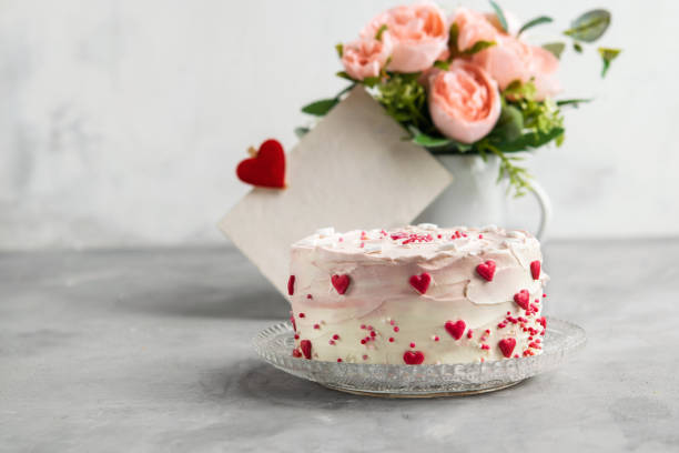istock Cake with small hearts and colorful sprinkles on a plate with coffee. Grey stone background. Romantic love concept. Valentine's day, Mother's Day, Birthday Cake card. Valentines day background. 1054971168
