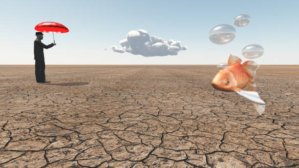 istock Man and floating fish in desert 1054974358
