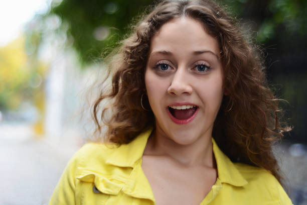 istock Young latin woman with surprised facial expression. 1054976400
