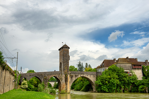 a medieval bridge over river Gave de Pau in Orthez - France
