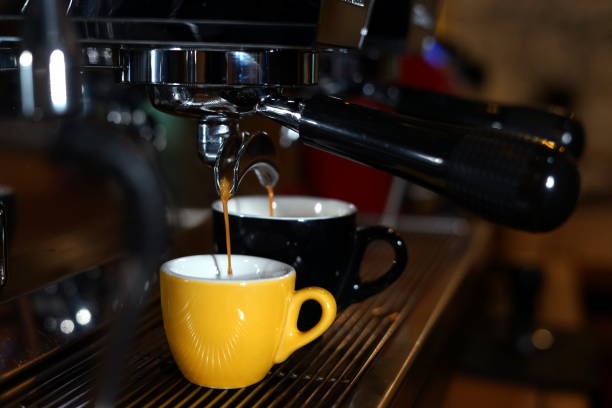 istock Barista machine pouring coffee 1054977504