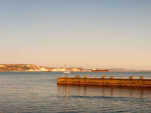 istock weymouth sunset beach sea waves ocean space dorset beautiful view landscape dock 1054978094