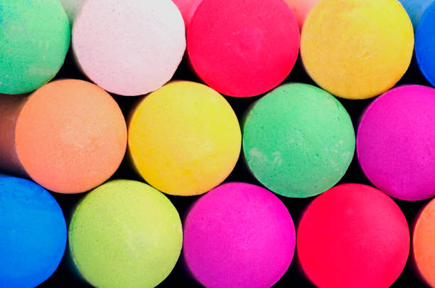 Colored sticks of sidewalk chalk for drawing on pavement, concrete or asphalt sidewalks.