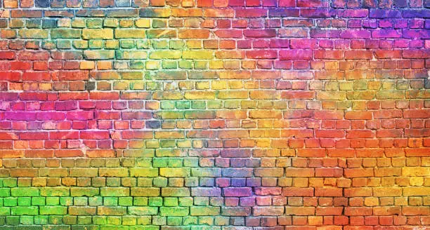 Photo of color brick wall, multi-colored masonry. rainbow background