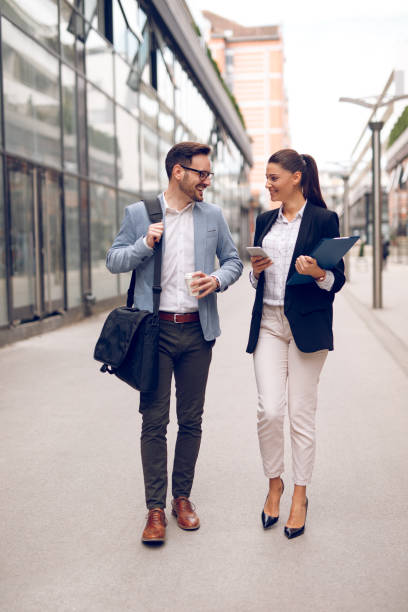 istock Two business people on their way to work 1054994400