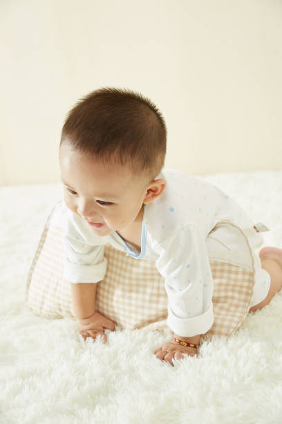 istock In the baby's bedroom, a little boy is playing happily alone 1054994466