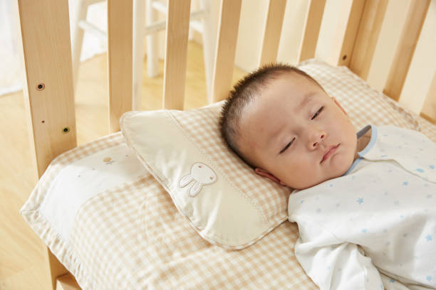 istock The little boy in the crib fell asleep 1054994572