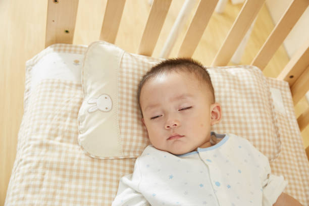 istock The little boy in the crib fell asleep 1054994616