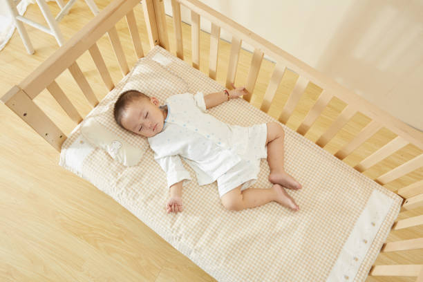 istock The little boy in the crib fell asleep 1054994630