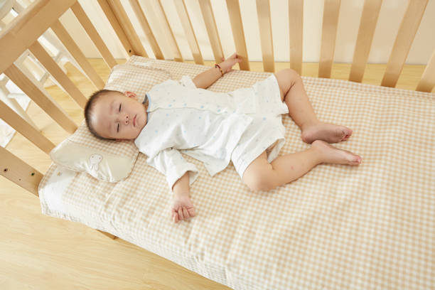 istock The little boy in the crib fell asleep 1054994676