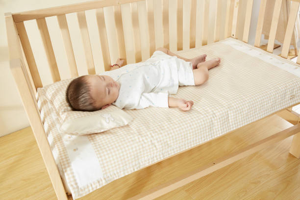 istock The little boy in the crib fell asleep 1054994702