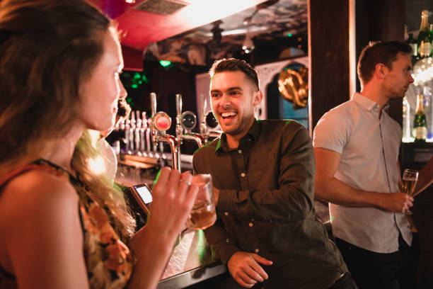 istock Small Group of Friends Chatting While Having a Drink 1054994710
