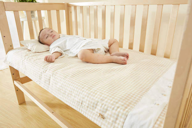 istock The little boy in the crib fell asleep 1054994762