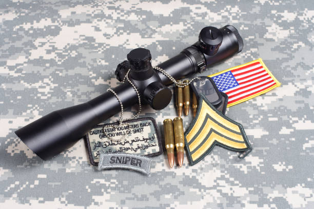 istock US ARMY background concept - sniper with scope and insignia 1054998980