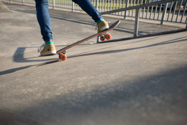 istock Skateboarder skateboarding at skatepark 1054999134