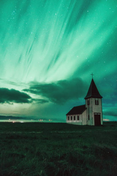 istock Aurora Borealis over church  in Iceland 1054999258