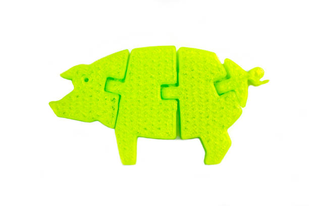 Elevated View Of Yellow Hardhat Over Pink Piggybank On White Background