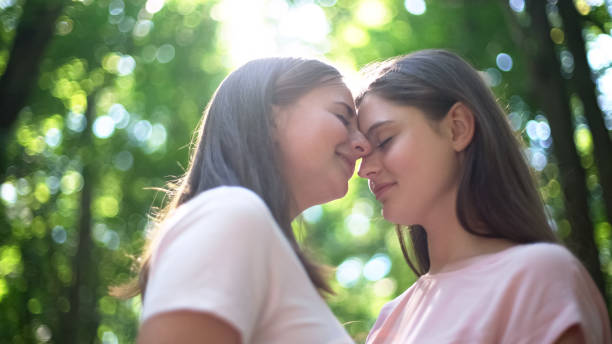 istock Intimate date of two lesbians, affectionate attitude to each other, closeup 1055005868