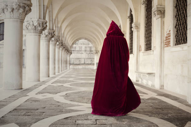 istock Mysterious person walking in old palace 1055009650