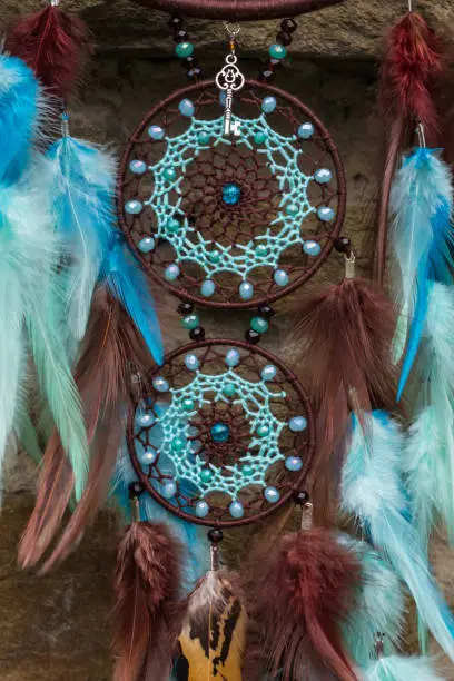 Photo of Handmade dream catcher with feathers threads and beads rope hanging