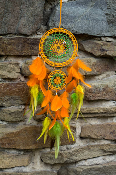 istock Handmade dream catcher with feathers threads and beads rope hanging 1055010706