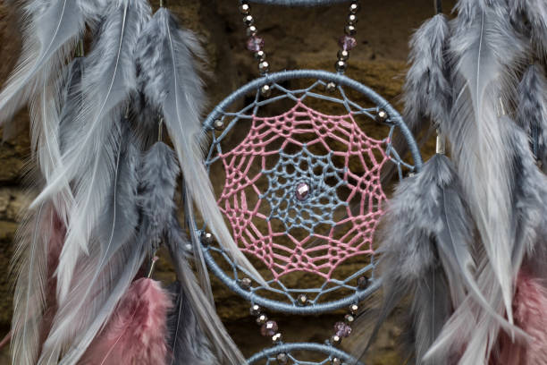 istock Handmade dream catcher with feathers threads and beads rope hanging 1055010810
