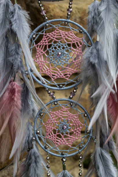 istock Handmade dream catcher with feathers threads and beads rope hanging 1055010830