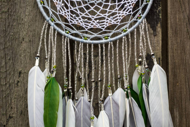 istock Handmade dream catcher with feathers threads and beads rope hanging 1055011116