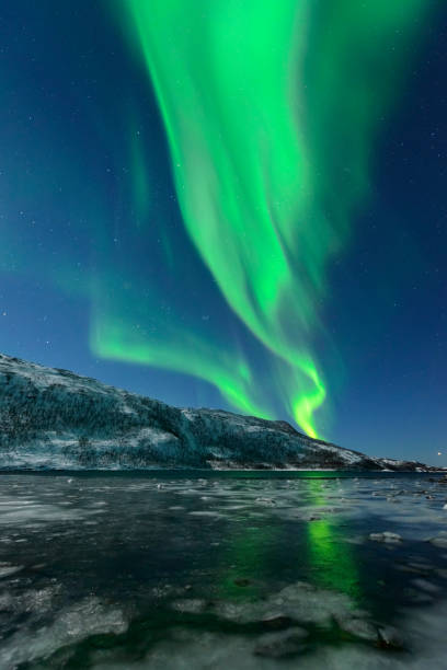 istock Aurora Northern Polar light in night sky over Northern Norway 1055011200