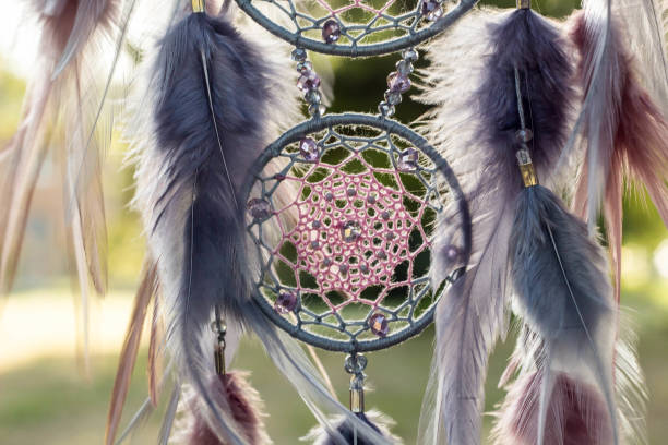 istock Handmade dream catcher with feathers threads and beads rope hanging 1055011514