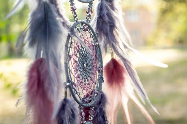 istock Handmade dream catcher with feathers threads and beads rope hanging 1055011536