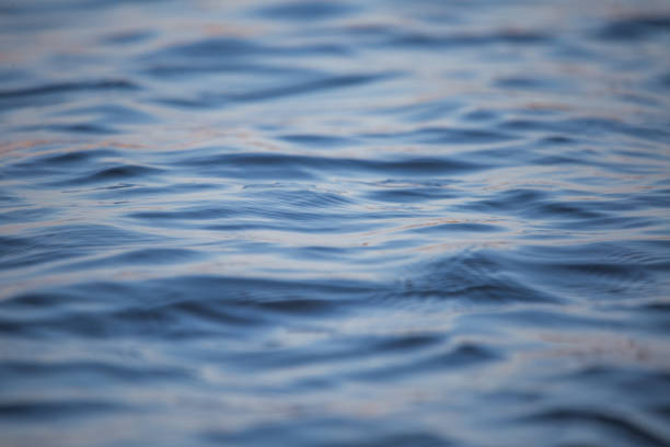 istock A beautiful water surface close up in the river. Waves with some reflections. 1055012024