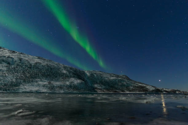 istock Aurora Northern Polar light in night sky over Northern Norway 1055012678