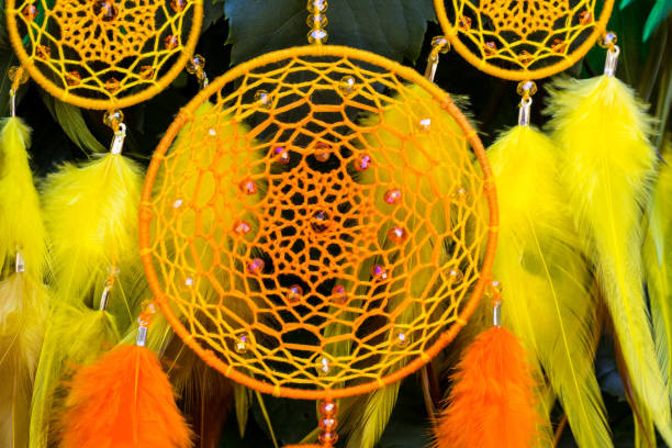 istock Handmade dream catcher with feathers threads and beads rope hanging 1055012782