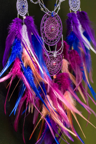 istock Handmade dream catcher with feathers threads and beads rope hanging 1055012880
