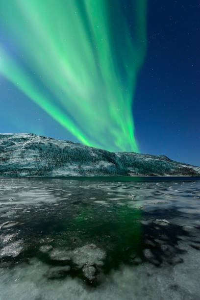 istock Aurora Northern Polar light in night sky over Northern Norway 1055012932