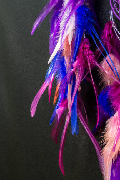 istock Handmade dream catcher with feathers threads and beads rope hanging 1055012934