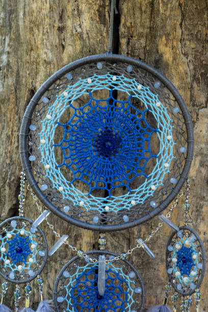 istock Handmade dream catcher with feathers threads and beads rope hanging 1055013404