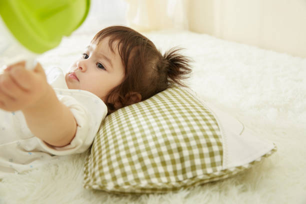 istock Cute little girl sleeping in bed 1055013678