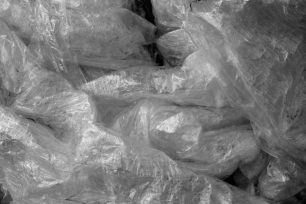 istock Old dirty plastic texture in black and white. 1055016724