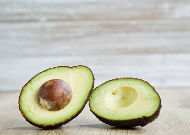 istock Avocado and  on a wooden background Free space 1055021176