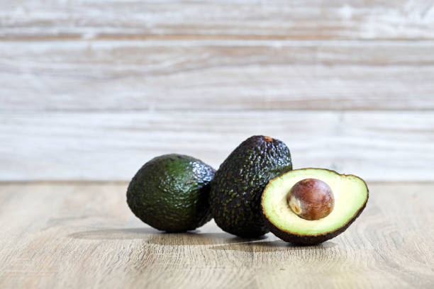istock Avocado and  on a wooden background Free space 1055021482