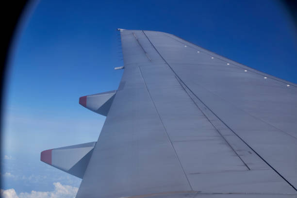 istock Looking through window aircraft  High angle view from airplane 1055021718