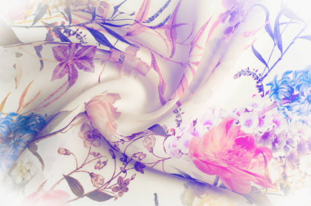 istock Texture, background, pattern. Silk fabric. Texture with pink and yellow flowers in watercolor technique. Wallpapers with roses, daisies and mimosa. Greeting card. Silk scarf, shawl. Holidays. 1055023186