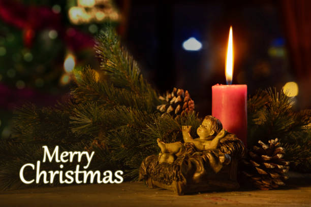 istock Merry Christmas text with a baby Jesus statue 1055023652